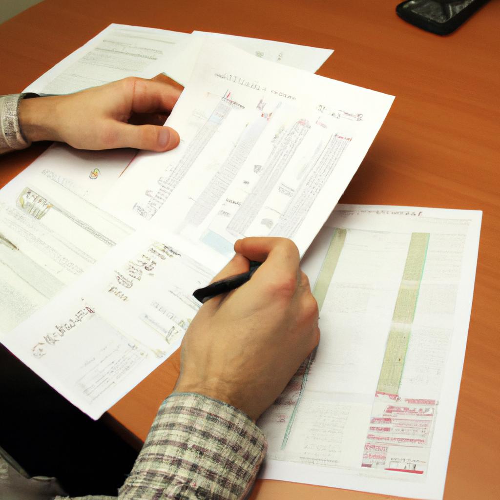 Person reviewing financial documents, brainstorming
